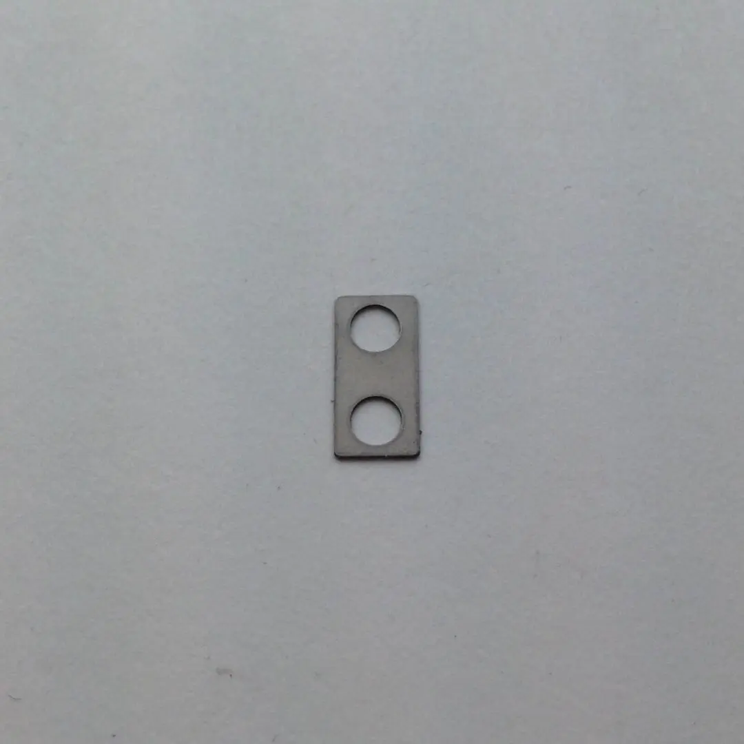 A metal piece of material on the wall.