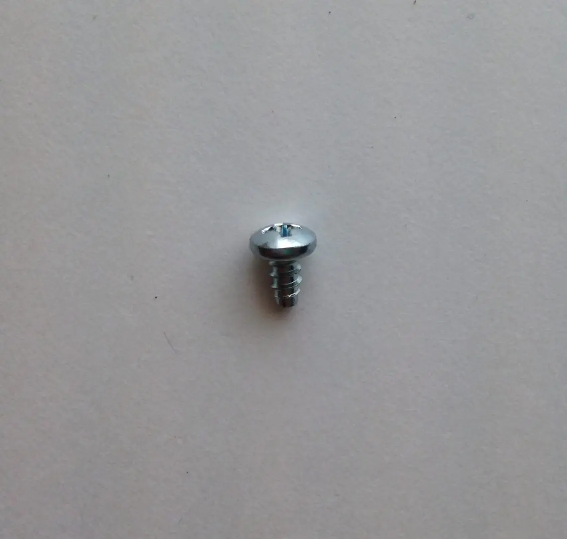 A close up of the screw on the wall