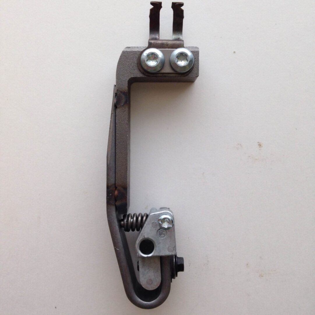 A metal object with two eyes on it.