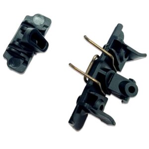 A pair of black plastic clips holding wires.
