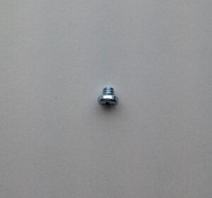 A small metal object sitting on top of a wall.