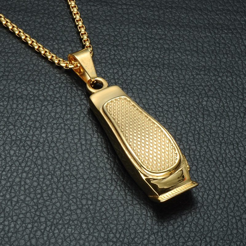 A gold plated pendant on a chain.