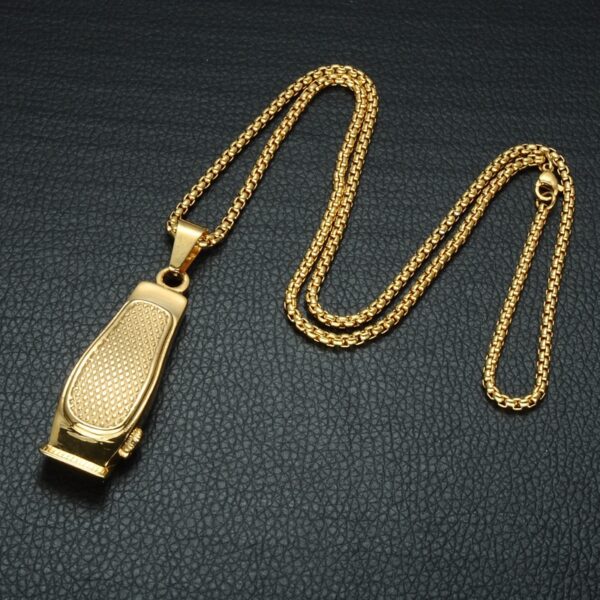 A gold plated whistle on a chain.