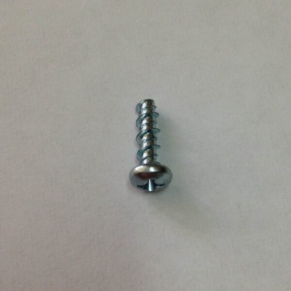 A close up of a screw on the wall