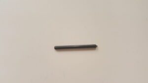 A black pencil is on the wall