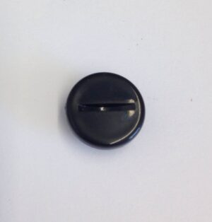 A black button on the wall