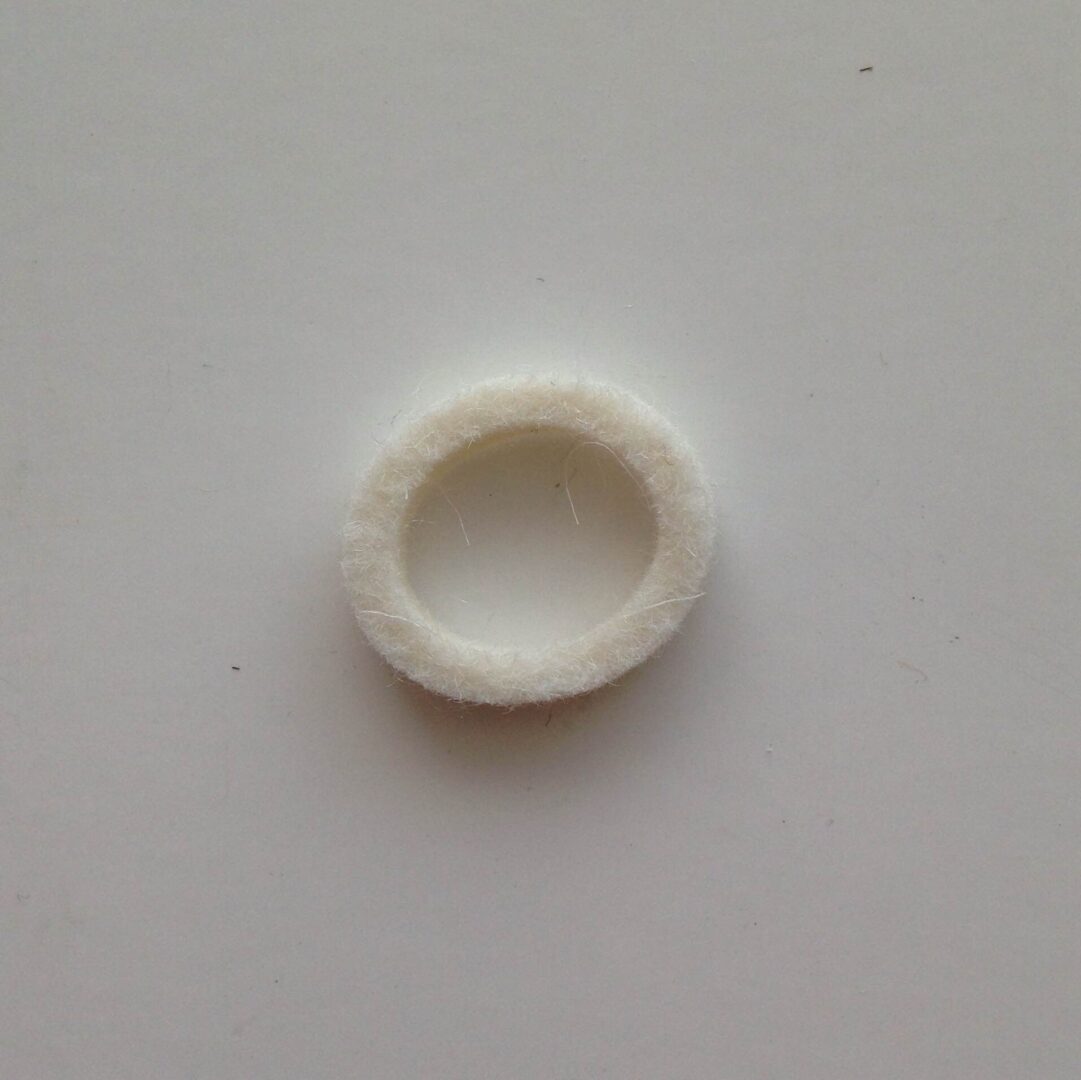 A white ring sitting on top of a table.