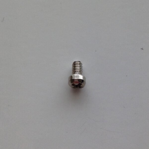 A close up of a screw on a white surface