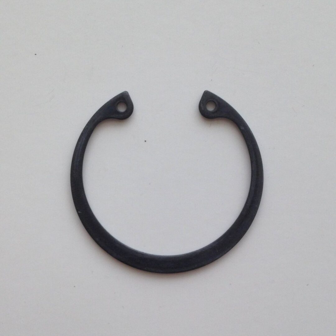 A black ring with two small holes on it.
