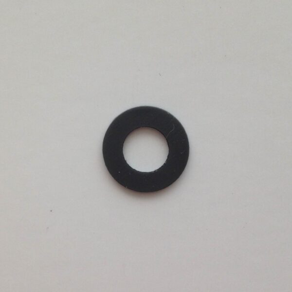 A black washer sitting on top of a white wall.