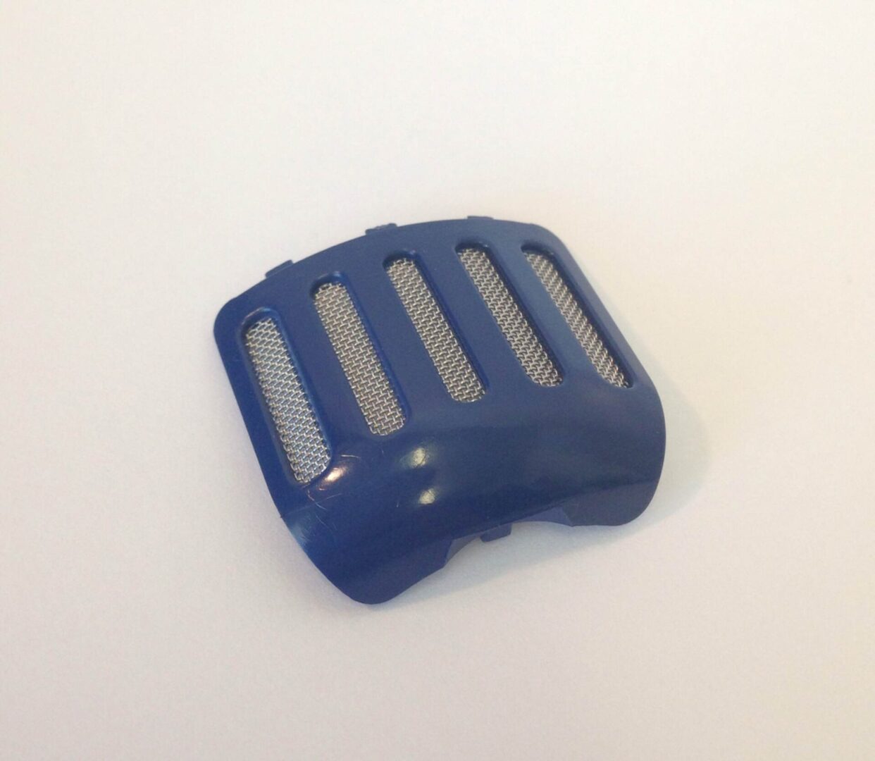 A blue plastic object sitting on top of a table.