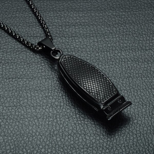 A black metal necklace with a small black object on it.