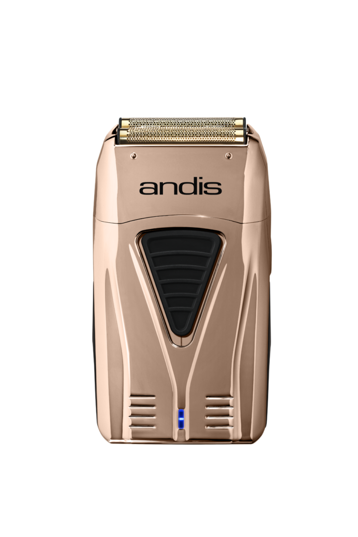 A gold electric razor with blue light on top of it.