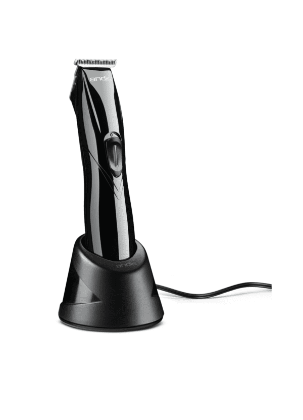 A black electric razor sitting on top of a table.