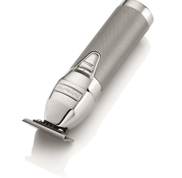 A close up of a hair trimmer on top of a white surface