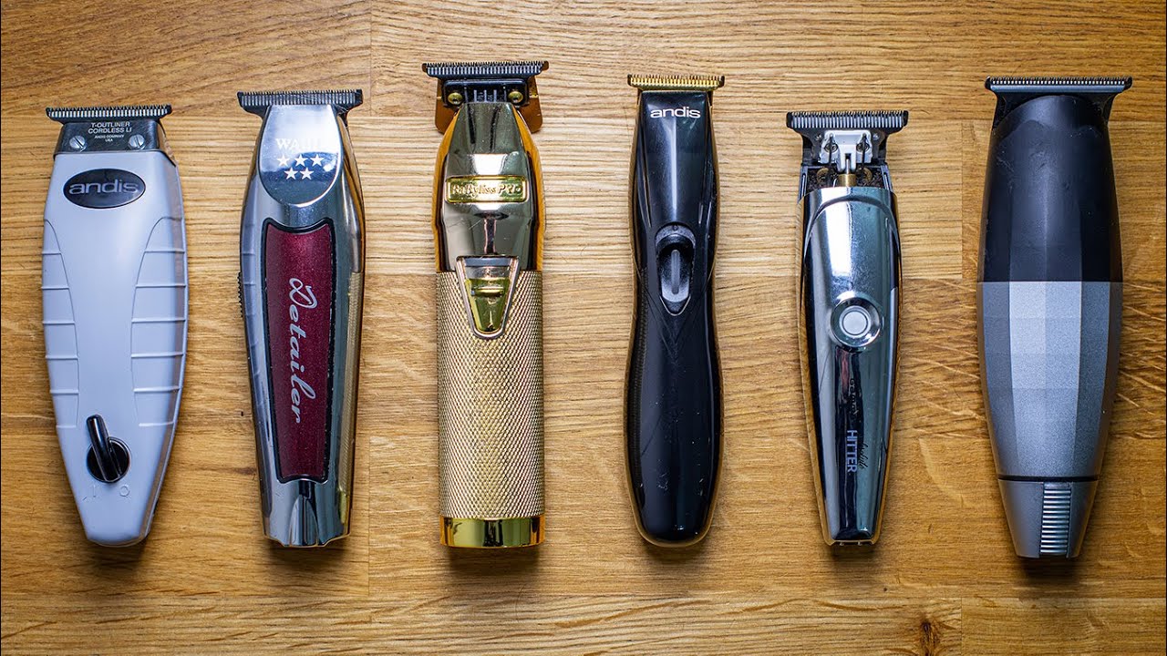 A wooden table with four different types of hair clippers.