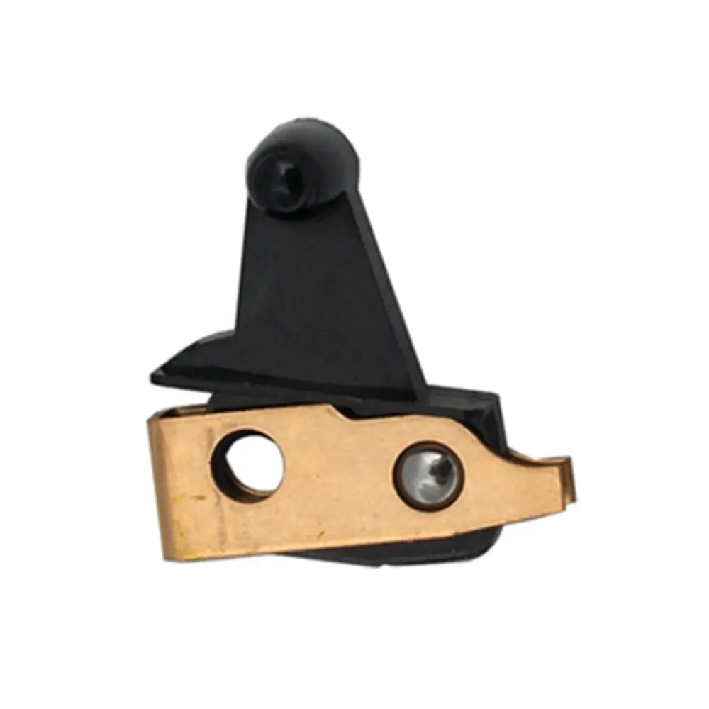 A black and gold metal clip holding something.
