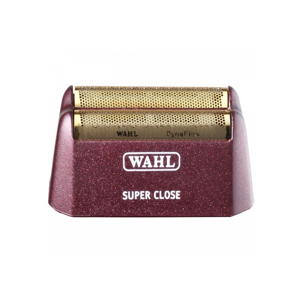 A red and gold wahl razor blade holder.