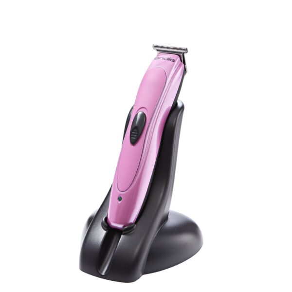 A pink hair trimmer sitting on top of a black stand.