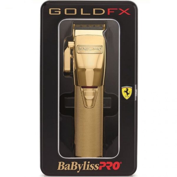 A gold colored hair trimmer in its packaging.