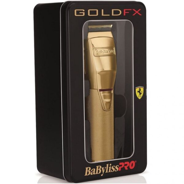 A box that has some gold colored hair clippers in it