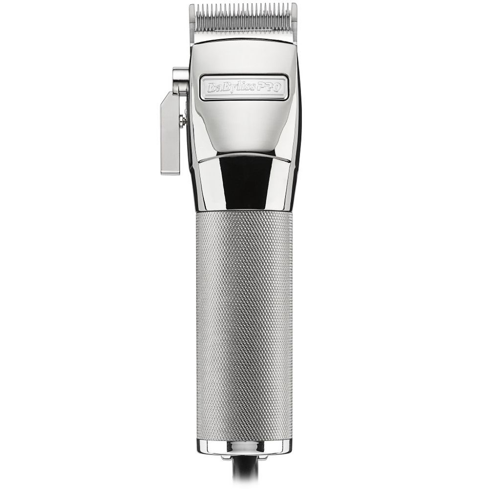 A silver hair trimmer is sitting on top of a white table.
