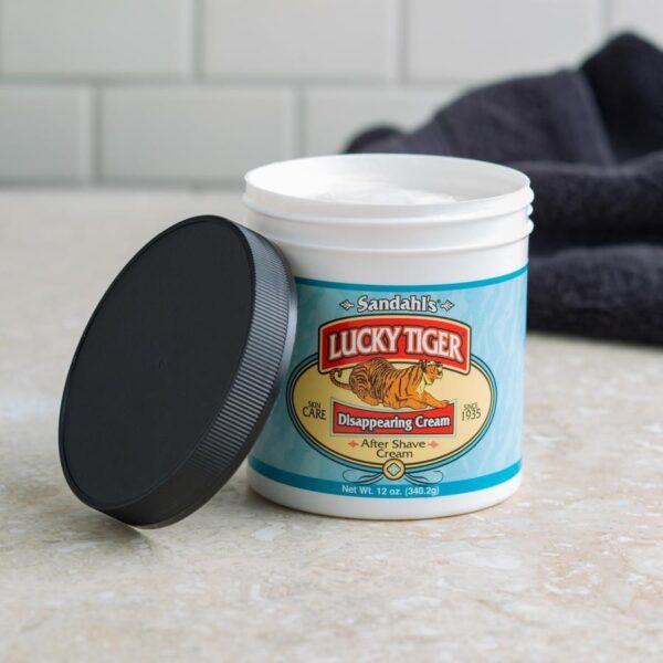 A container of lucky tiger 's strawberry cream on the counter.