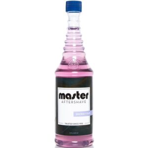 A bottle of pink liquid with the label " master aftershave ".