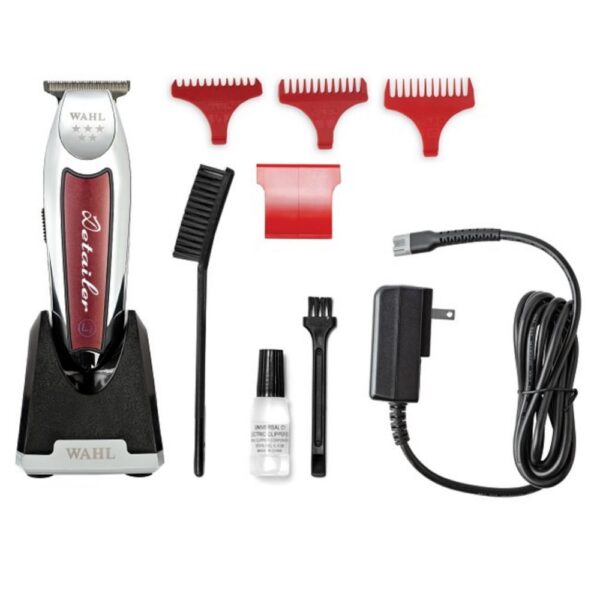 A red and white electric razor with accessories.