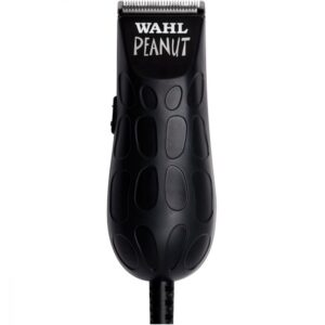 A black wahl peanut trimmer sitting on top of a white table.