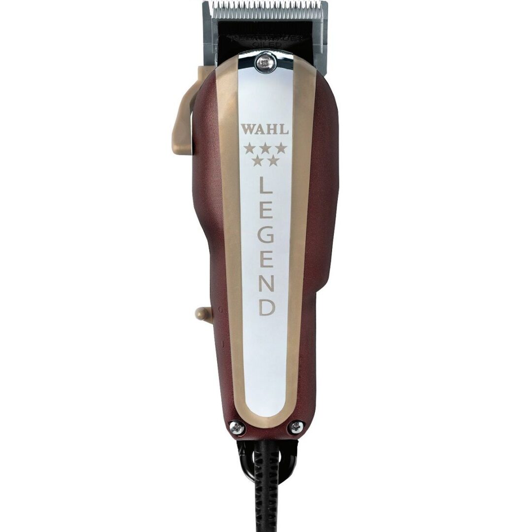A brown and white hair clipper sitting on top of a table.