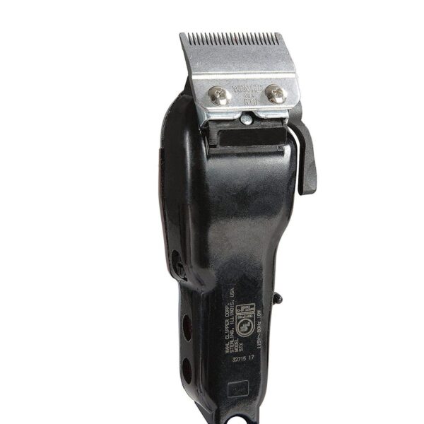 A black electric hair clipper on top of a white background.
