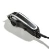 A close up of a hair trimmer on a white surface
