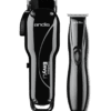 A black and silver electric hair clippers on green background