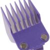 A purple comb is sitting on top of a table.