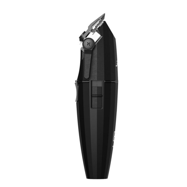 A black electric hair trimmer is sitting on the floor.